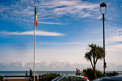 Indian flag by sea against sky