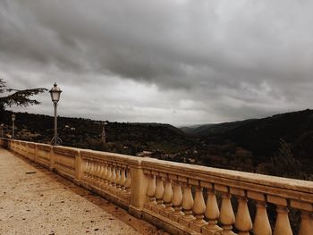 Bridge over street against sky