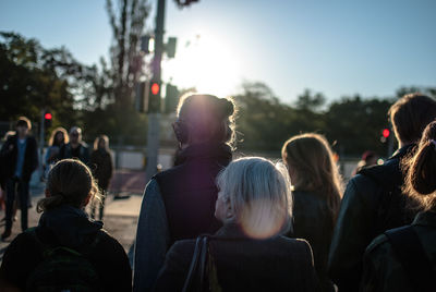 Commuters standing at roadside