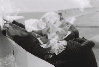 Double exposure of flowers and woman