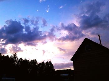 Silhouette of house at sunset