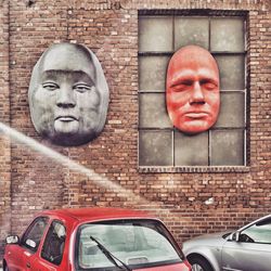 Close-up of car on brick wall