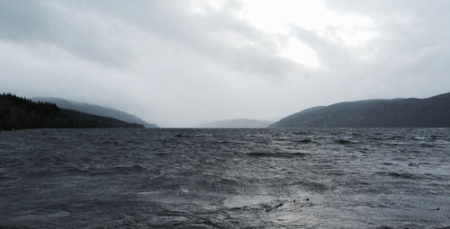 Scenic view of ocean against cloudy sky