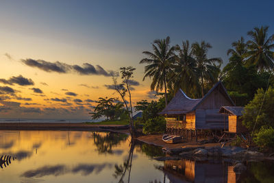 Scenic view of lake against sky during sunset