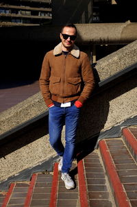 Young man wearing sunglasses standing outdoors