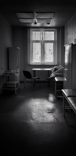 Empty chairs and tables in building