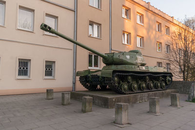 Houses by street and buildings in city