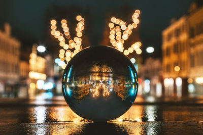 Close-up of crystal ball on glass