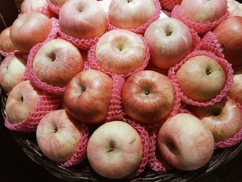 High angle view of apples in basket for sale