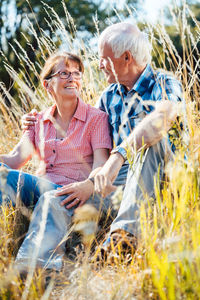 Rear view of a couple on field