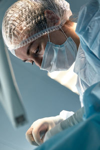 Surgeon performing surgery at hospital