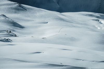 Group of people ski touring in winter wonderland in the austrian alps, gastein, salzburg, austria