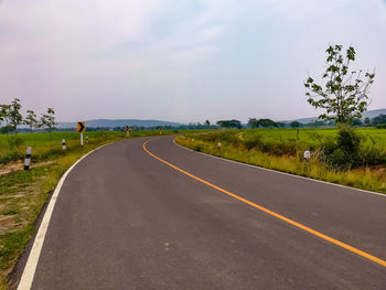 Empty road against sky