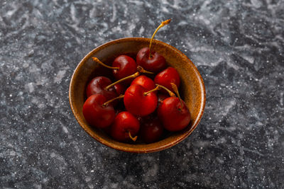 High angle view of strawberries in bowl on table