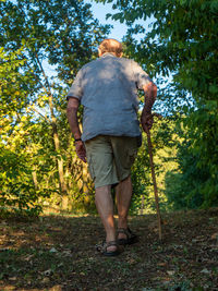 Rear view of man standing on field