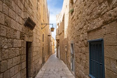 Narrow alley along buildings