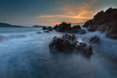 Scenic view of sea against sky during sunset