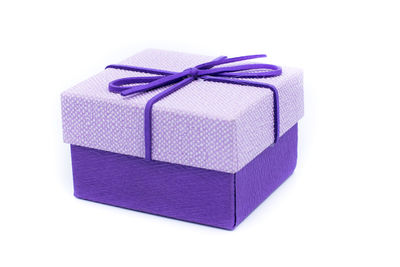 Close-up of purple paper against white background