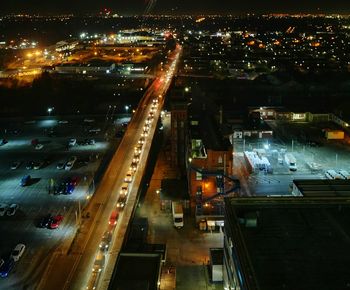 High angle view of illuminated city at night