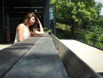 Woman sitting on table