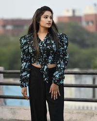 Portrait of young woman standing outdoors