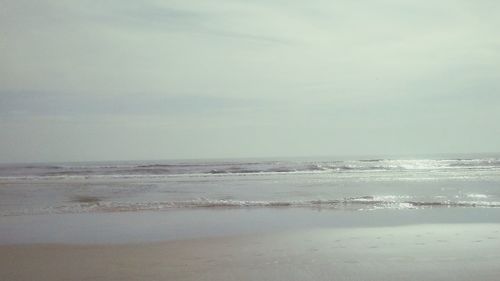 Scenic view of beach and sea against sky