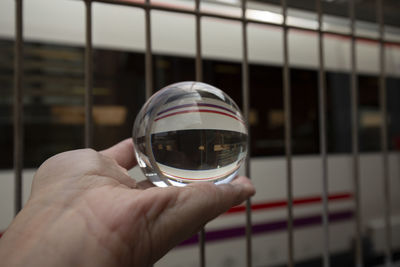 Close-up of hand holding glass