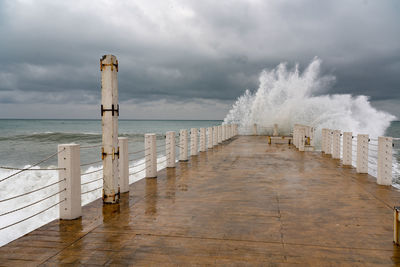 Pier over sea against sky