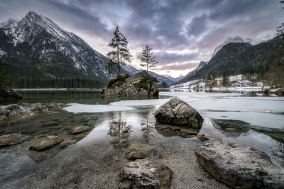 Scenic view of lake against sky during winter