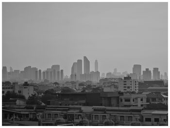 Buildings in city against sky