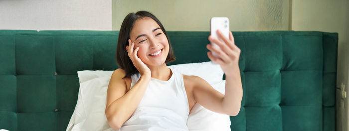 Young woman using mobile phone