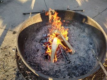 High angle view of fire on barbecue grill