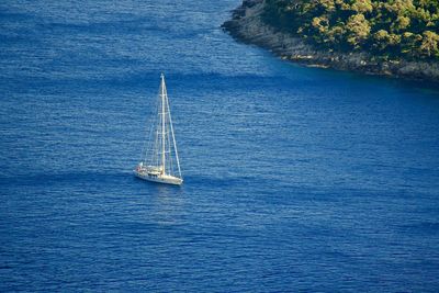 High angle view of sailboat sailing in sea