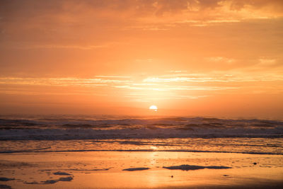 Scenic view of sea against sky during sunrise 