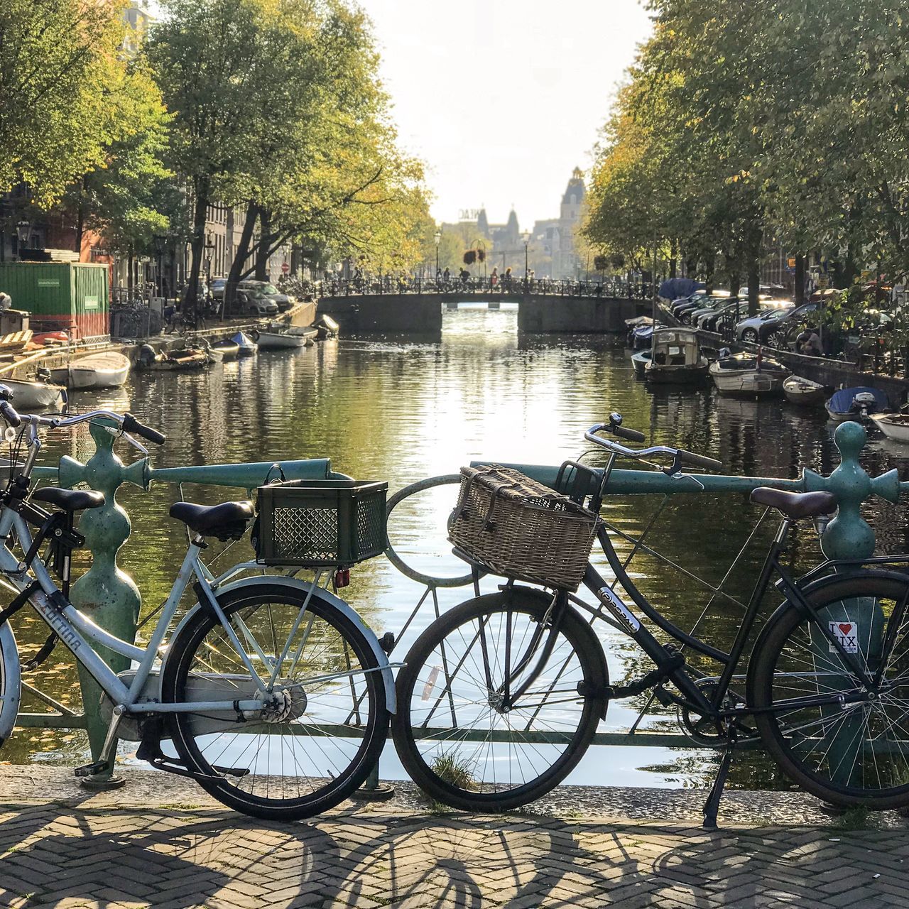 BICYCLE PARKED BY CANAL