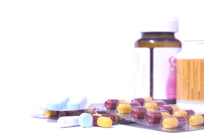 Close-up of bottles against white background