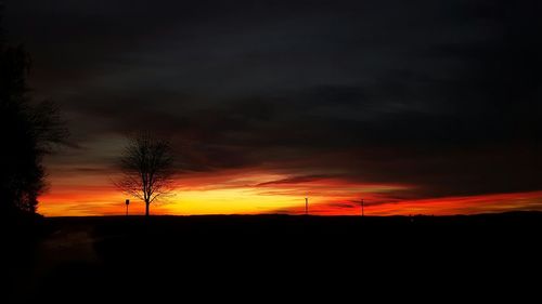 Silhouette of landscape against dramatic sky