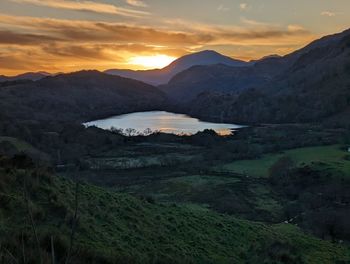 Scenic view of mountains against sky during sunset