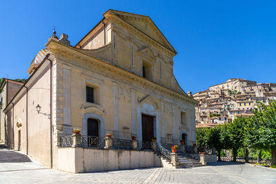 Exterior of historic building against blue sky