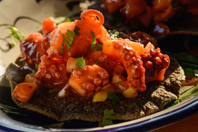 Octopus ceviche on blue corn tostadas, mexican seafood dish