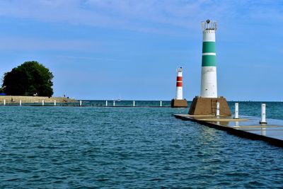 Towers by lake against sky.  enterance to montrose harbor, chicago, il. 