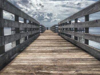 Bridge over footbridge against sky