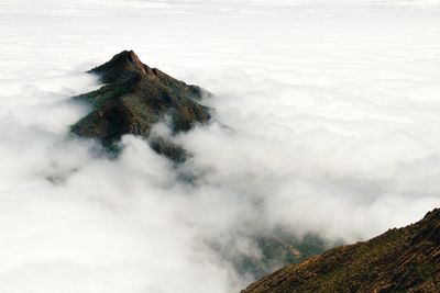 Scenic view of volcanic mountain against sky