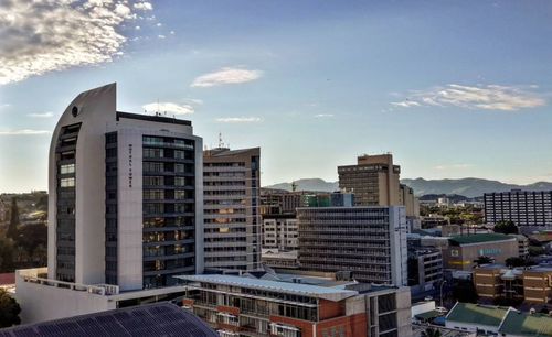 Buildings in city against sky