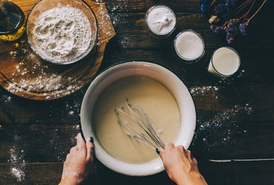 High angle view of person preparing food on table