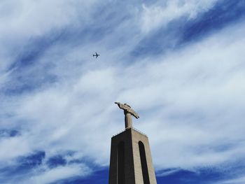 Low angle view of seagull flying in sky