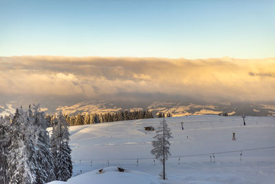 Scenic view of snow covered landscape against sky