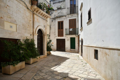 A small street in casamassima, a village with blue-colored houses in the puglia region of italy.