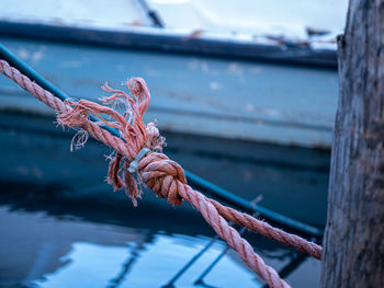 Close-up of rope tied to bollard