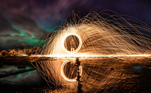 Light painting against sky at night